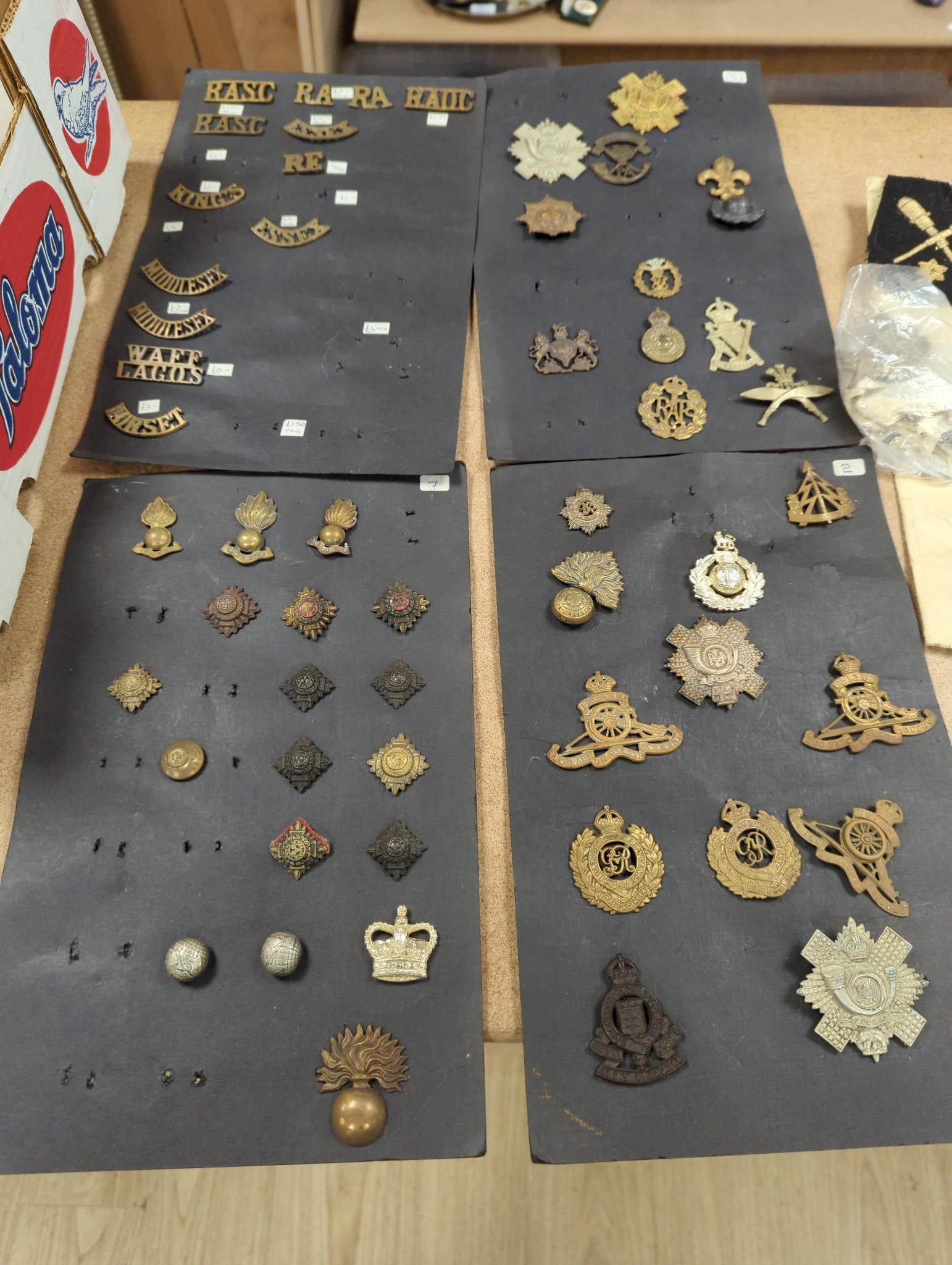 A group of British military cap badges and buttons, various commemorative medals and Pakistan General Service Medals